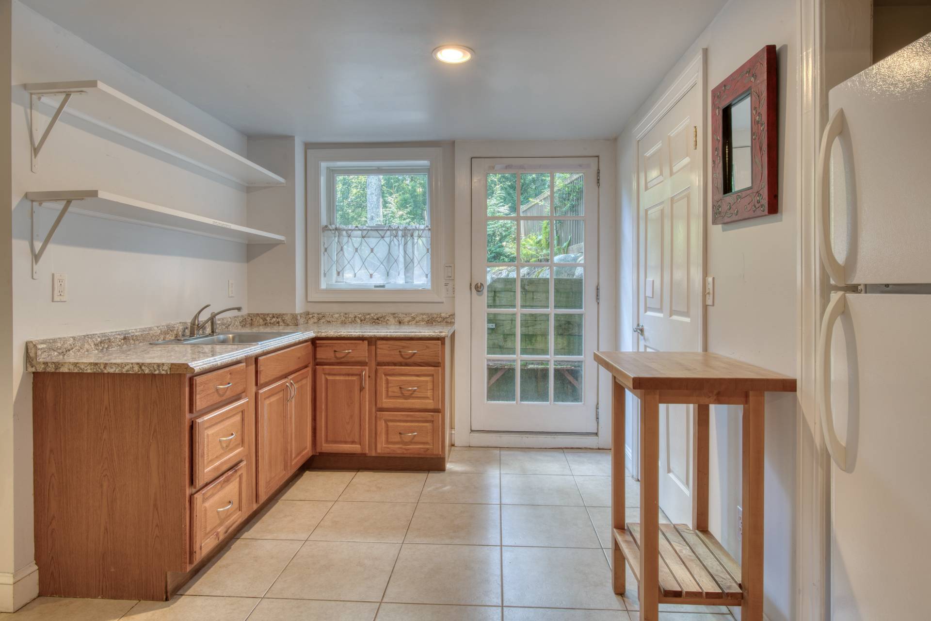 1 Abigails Path East Hampton, NY 11937 - Photo 13 of 18 a kitchen with stainless steel appliances granite countertop a refrigerator and a sink