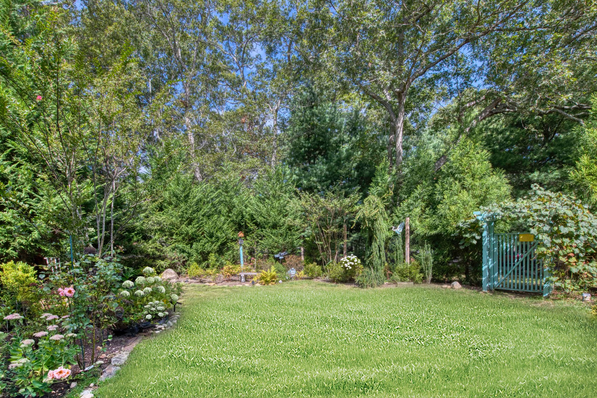 1 Abigails Path East Hampton, NY 11937 - Photo 15 of 18 a view of green field with trees in the background