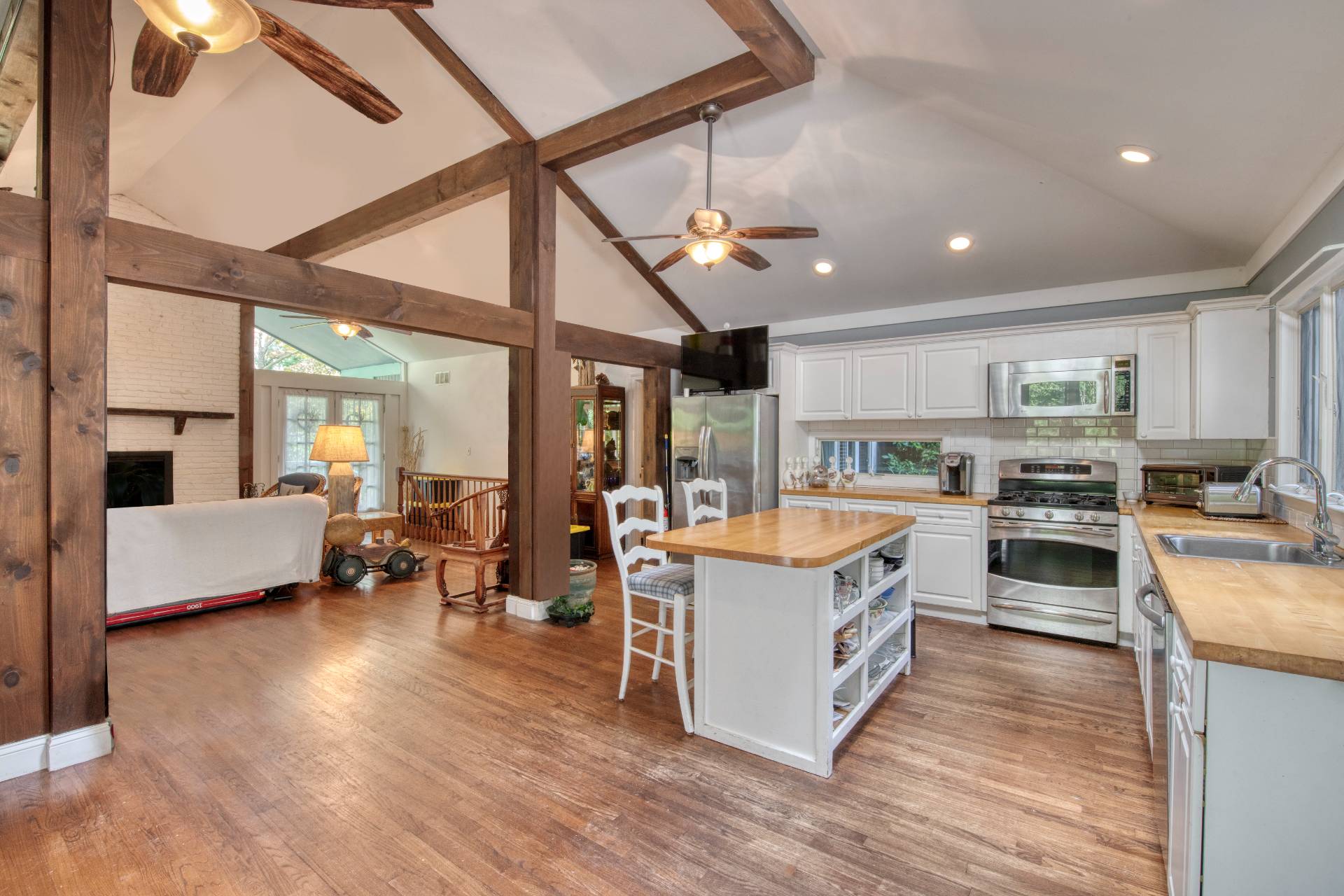 1 Abigails Path East Hampton, NY 11937 - Photo 6 of 18 a large kitchen with stainless steel appliances granite countertop a lot of cabinets and wooden floors