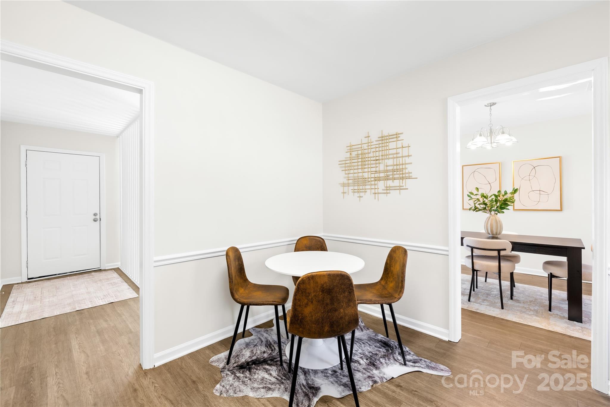11816 Park Road Charlotte, NC 28226 - Photo 14 of 26 a view of a dining room with furniture and wooden floor