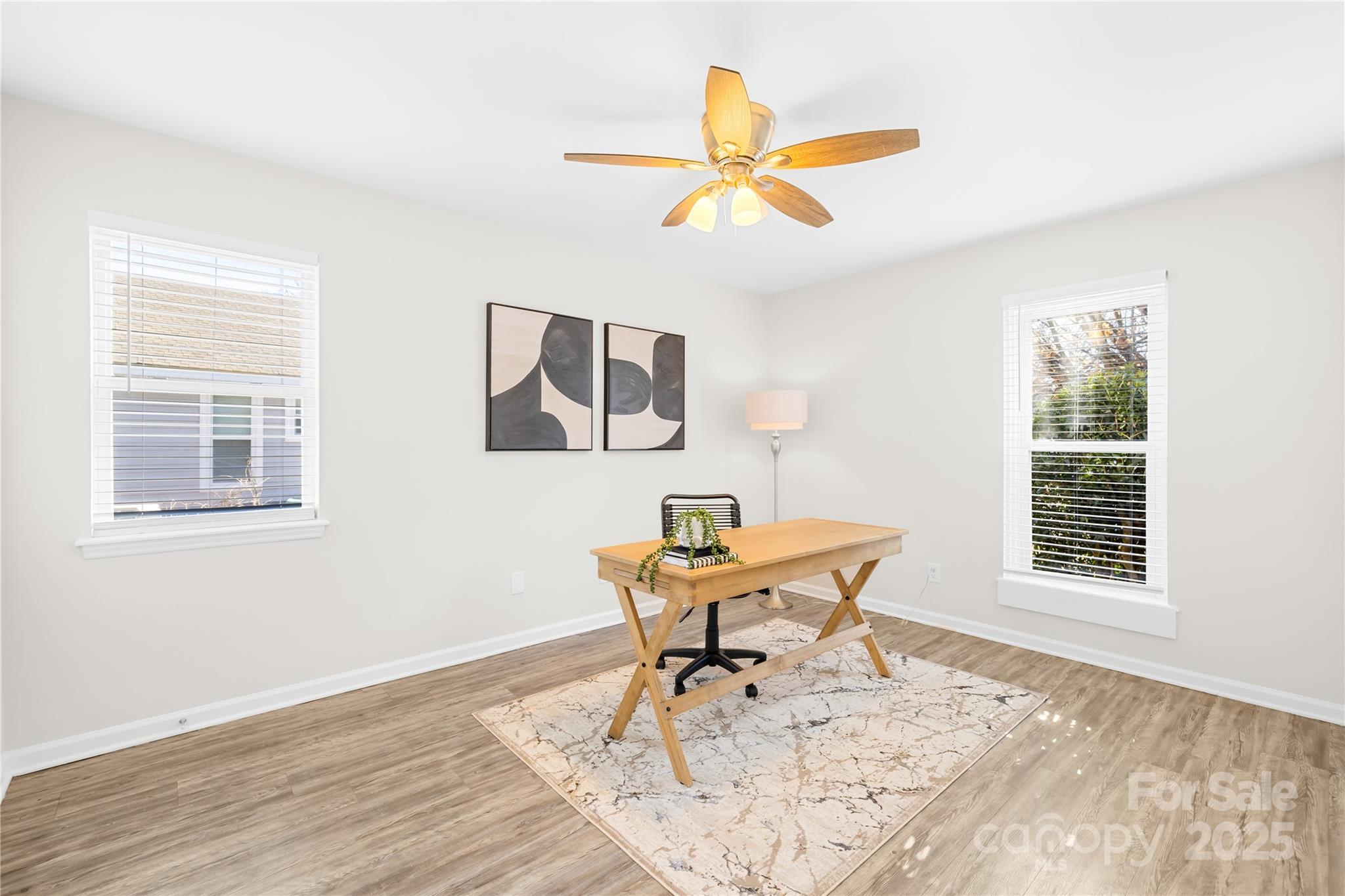11816 Park Road Charlotte, NC 28226 - Photo 18 of 26 a workspace room with wooden floor and windows