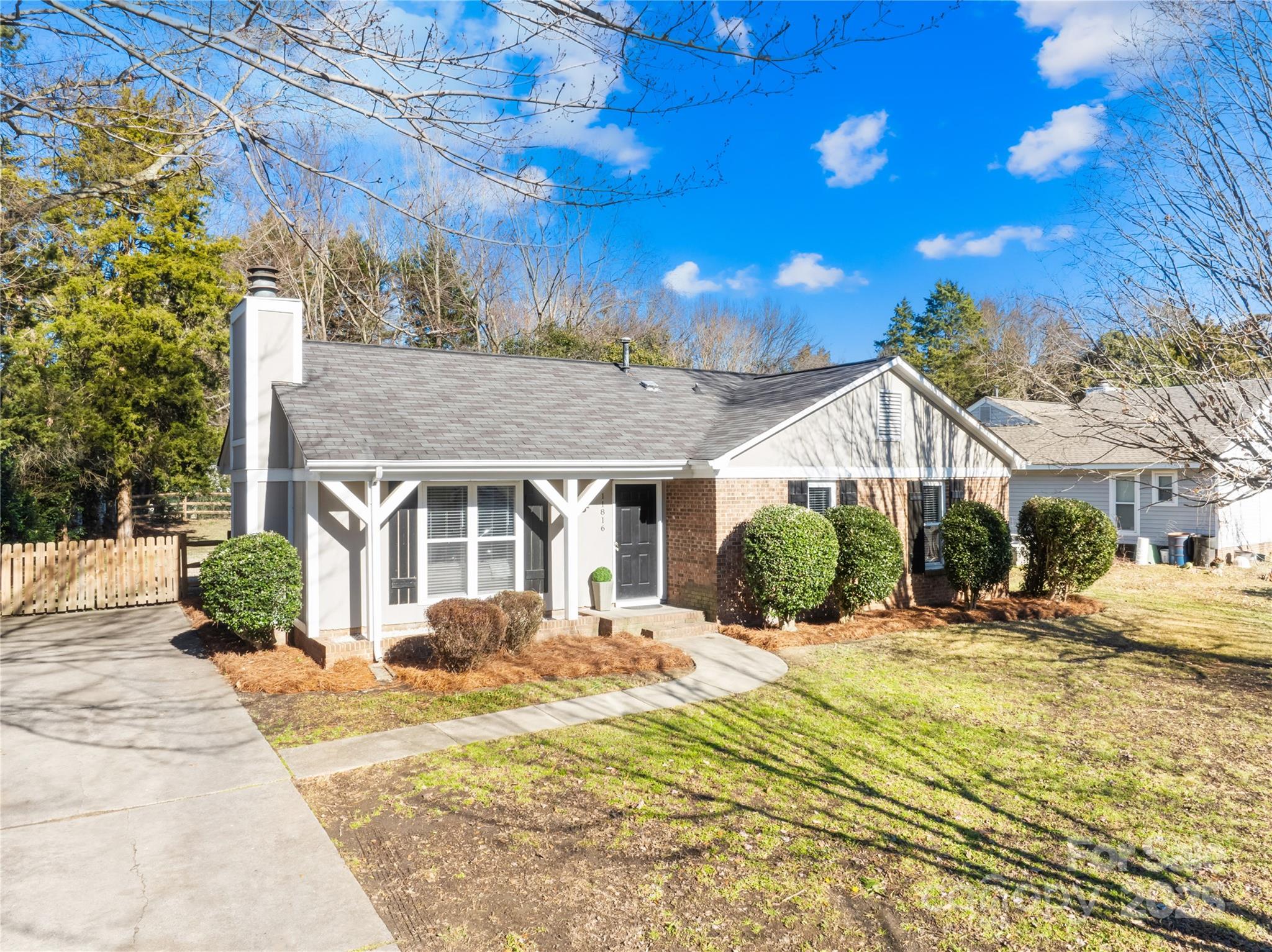 11816 Park Road Charlotte, NC 28226 - Photo 2 of 26 a front view of a house with a yard