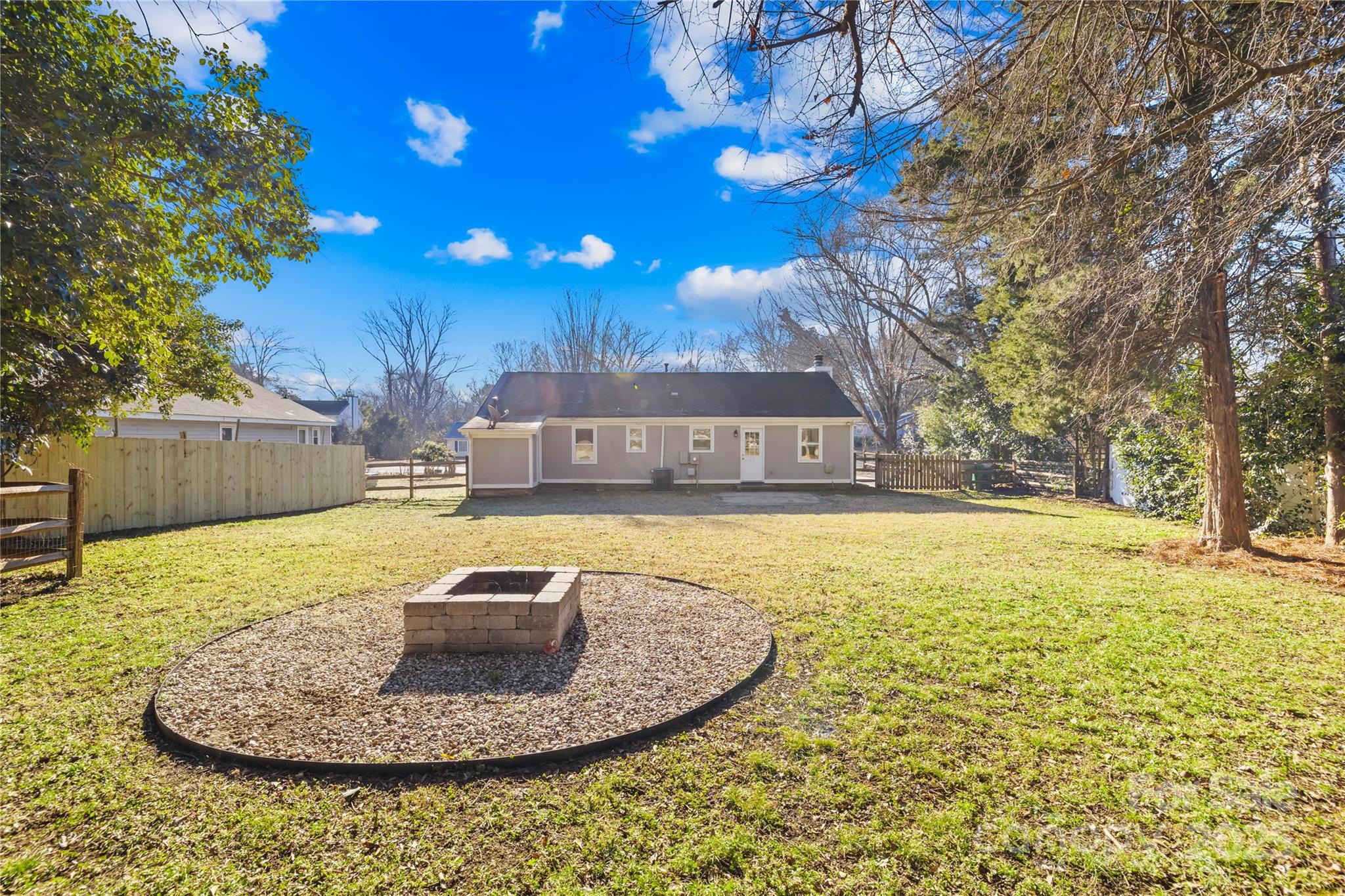 11816 Park Road Charlotte, NC 28226 - Photo 21 of 26 a swimming pool with wooden fence