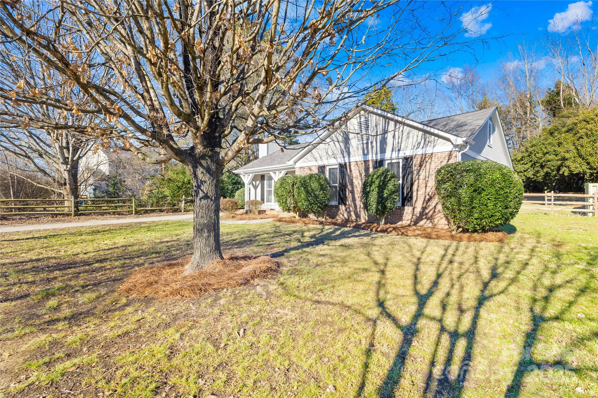 11816 Park Road Charlotte, NC 28226 - Photo 3 of 26 a view of a house with snow on the road