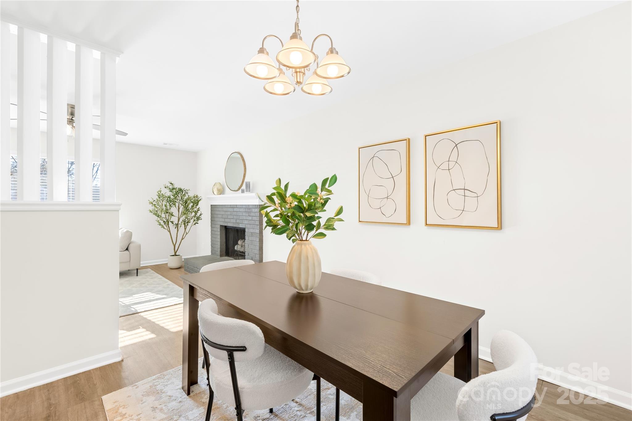 11816 Park Road Charlotte, NC 28226 - Photo 10 of 26 a view of a dining room with furniture and a chandelier