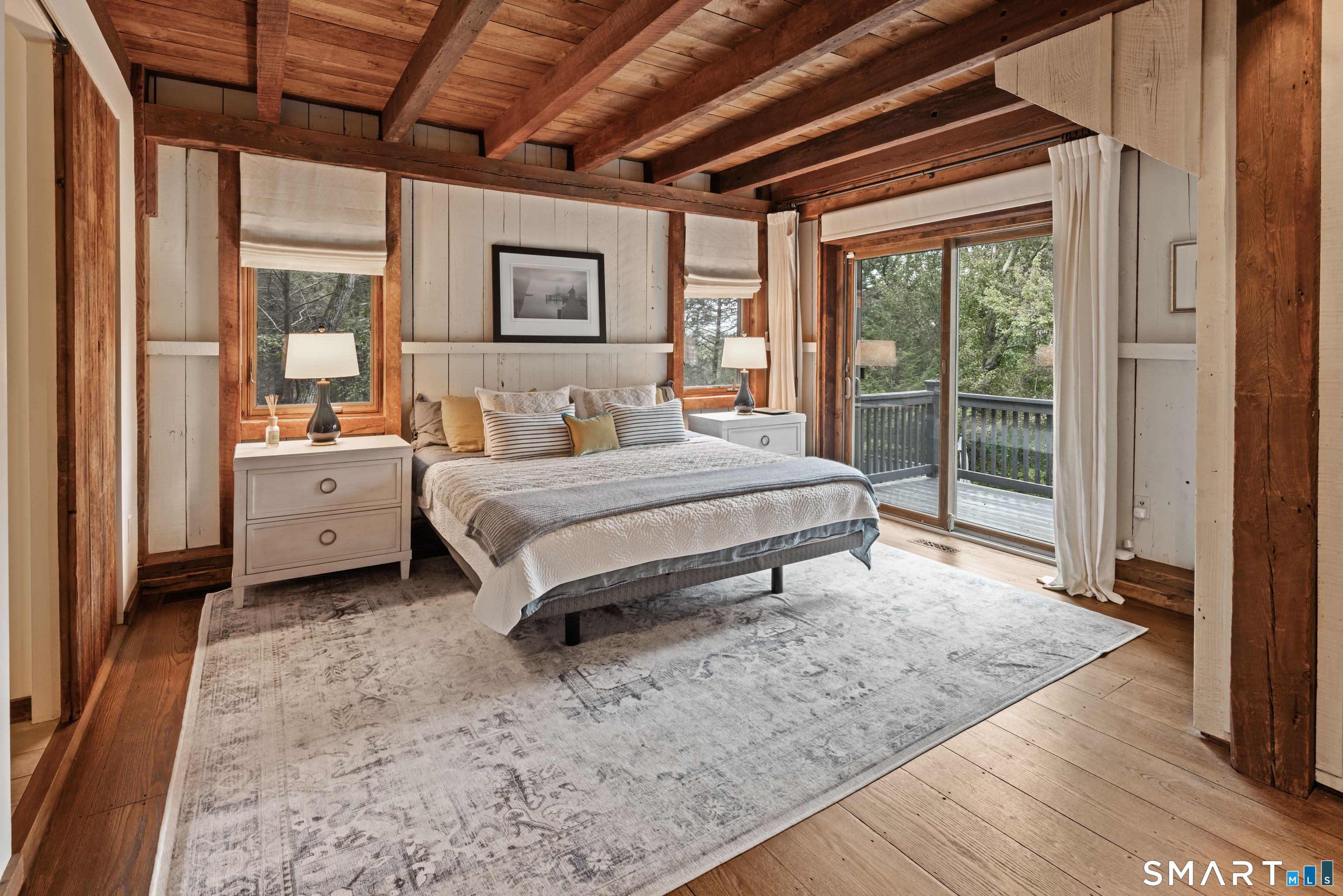 129 Davis Hill Road Weston, CT 06883 - Photo 23 of 40 a spacious bedroom with a bed and a large window