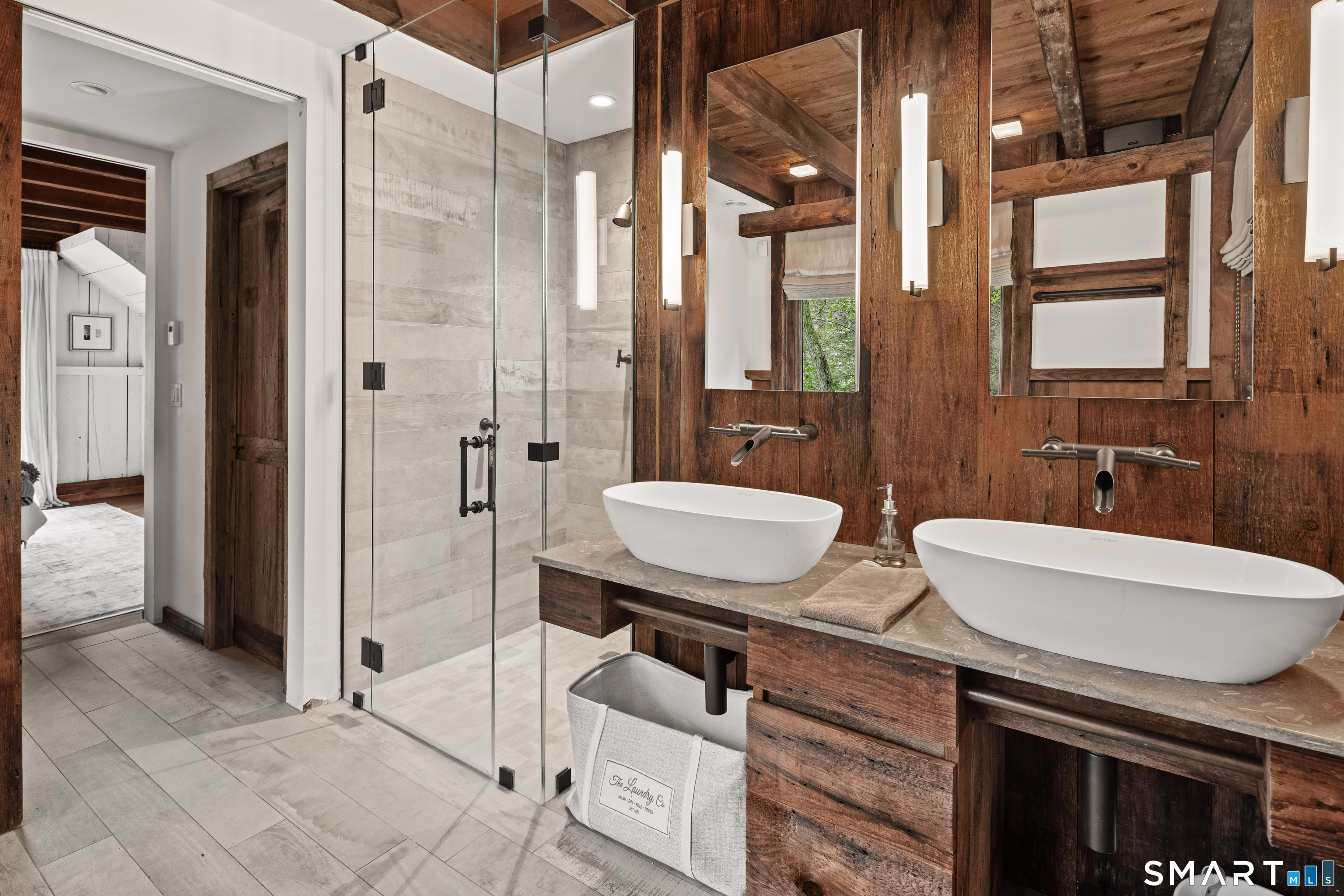 129 Davis Hill Road Weston, CT 06883 - Photo 25 of 40 a bathroom with a sink a toilet a mirror and shower