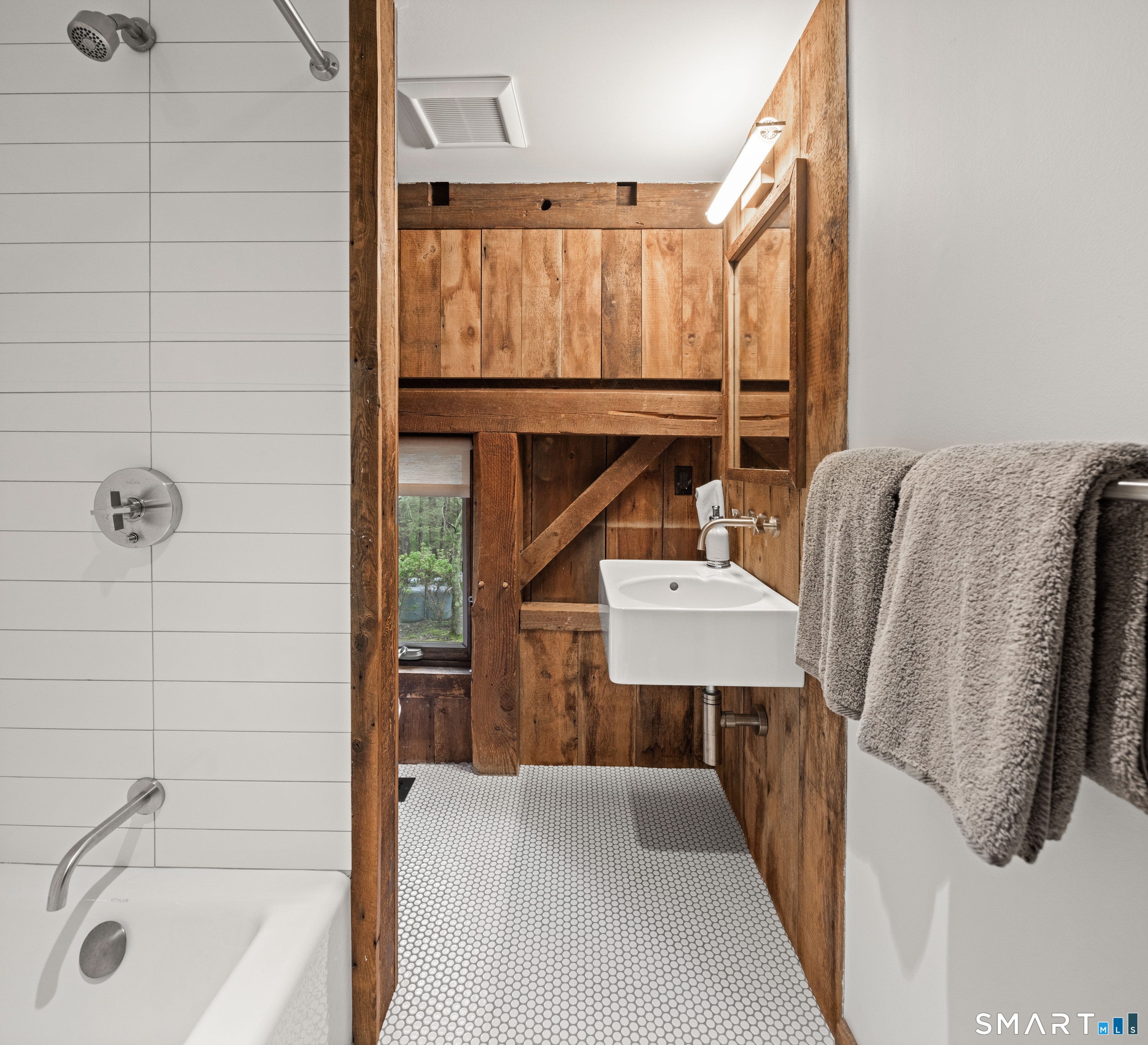 129 Davis Hill Road Weston, CT 06883 - Photo 30 of 40 a bathroom with a sink a mirror and shower