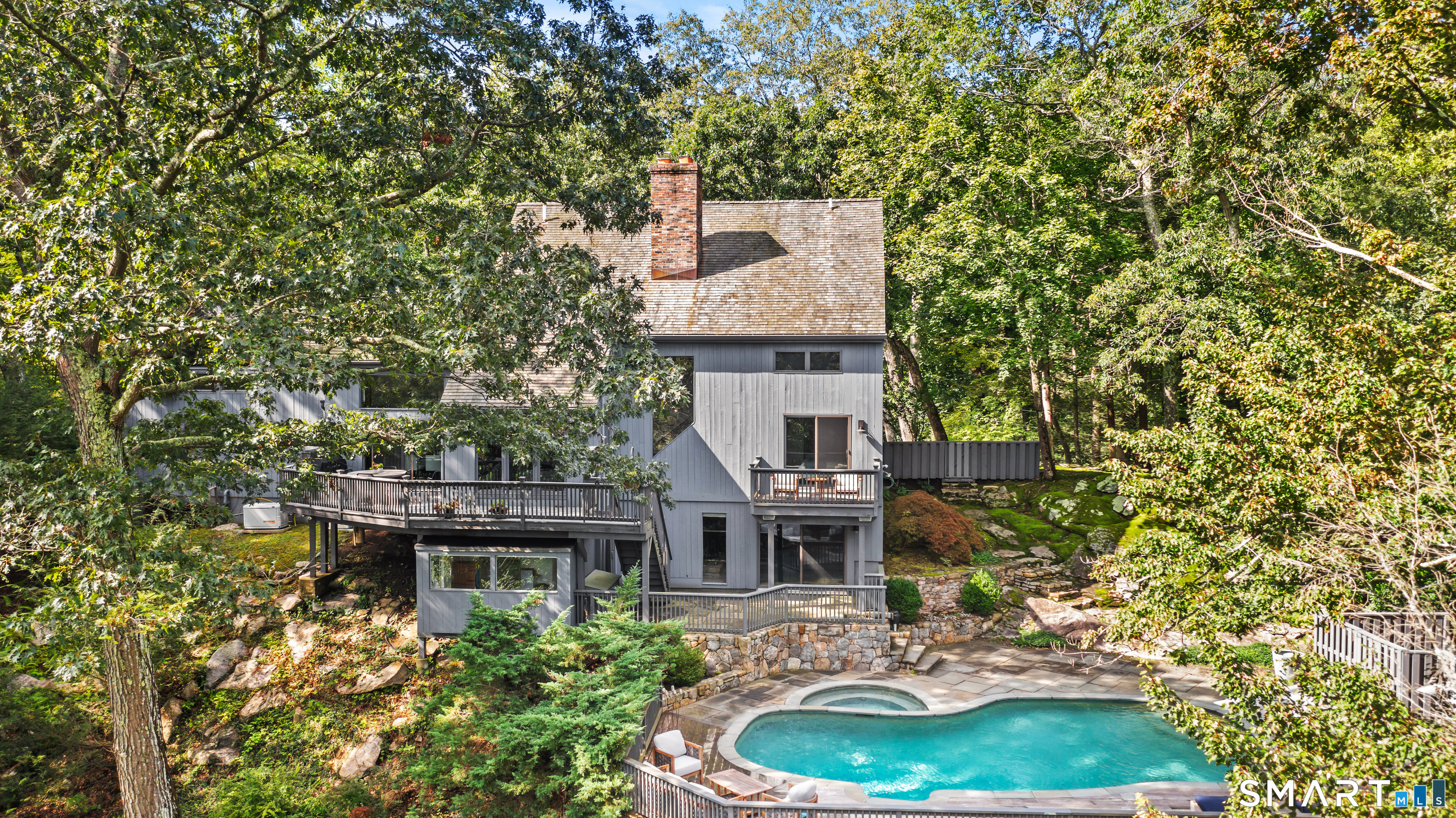 129 Davis Hill Road Weston, CT 06883 - Photo 3 of 40 a house with swimming pool in front of it