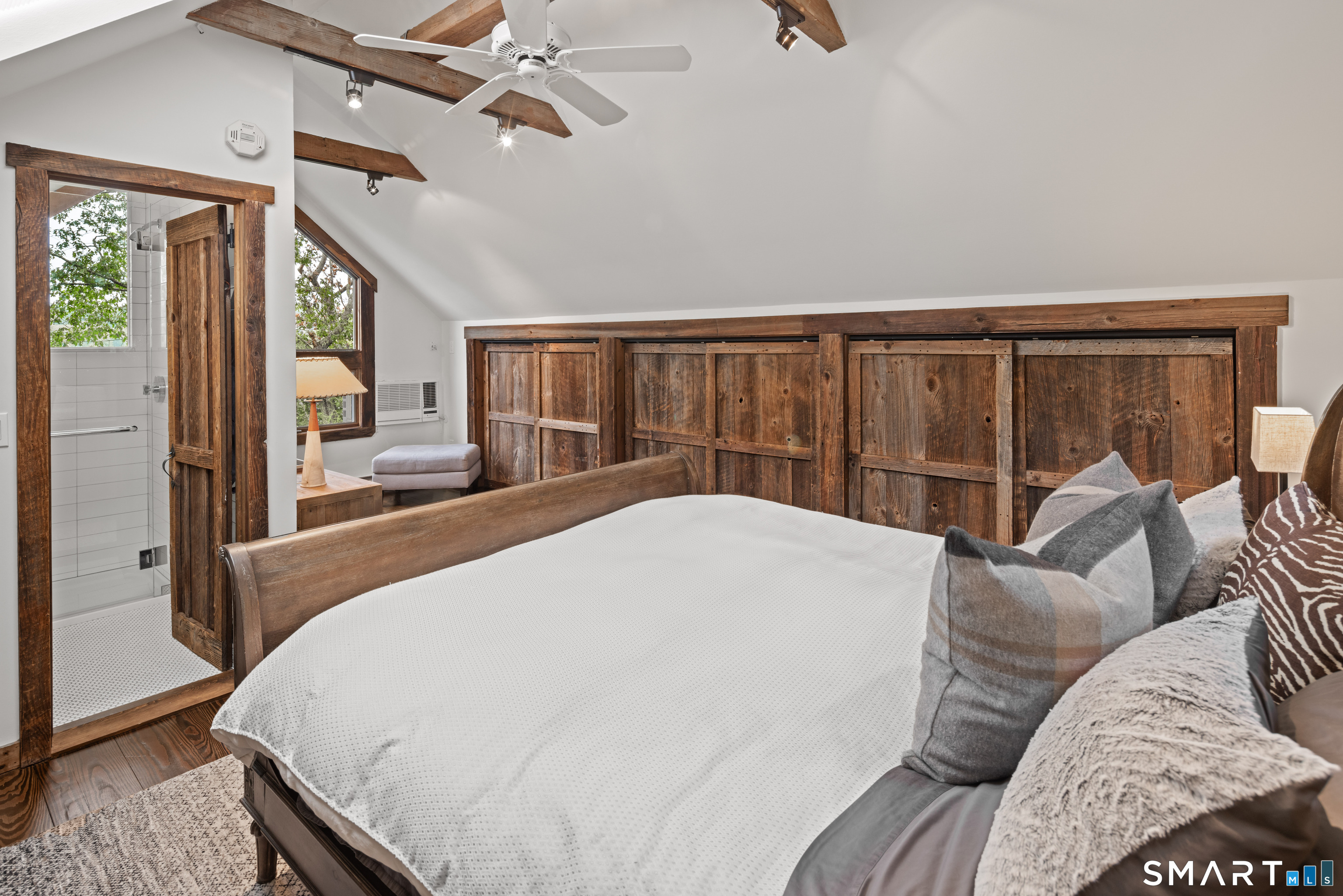 129 Davis Hill Road Weston, CT 06883 - Photo 33 of 40 a bedroom with a large bed and a large window