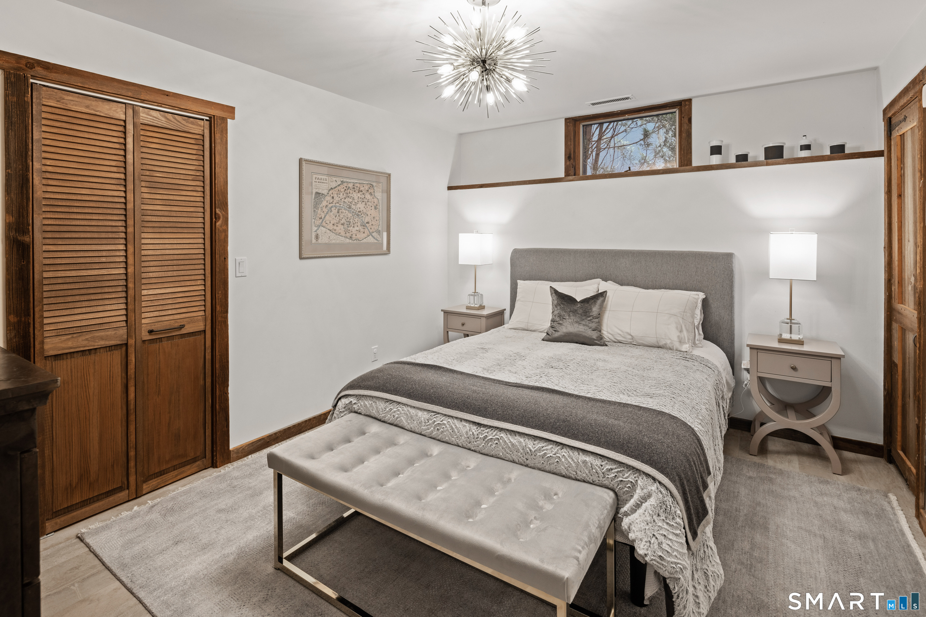 129 Davis Hill Road Weston, CT 06883 - Photo 36 of 40 a bedroom with a bed and a lamp on table