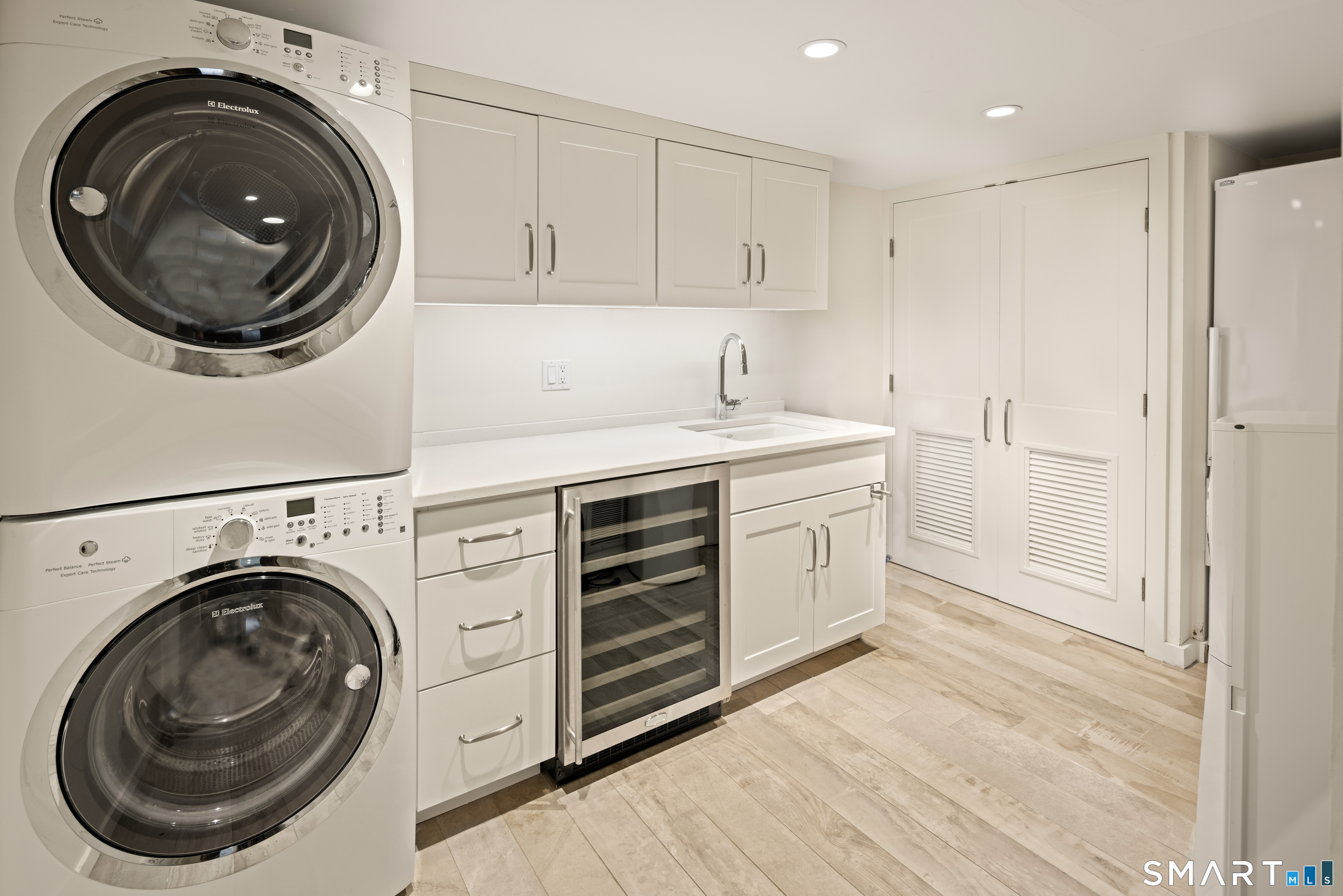 129 Davis Hill Road Weston, CT 06883 - Photo 40 of 40 a view of a hallway with washer and dryer