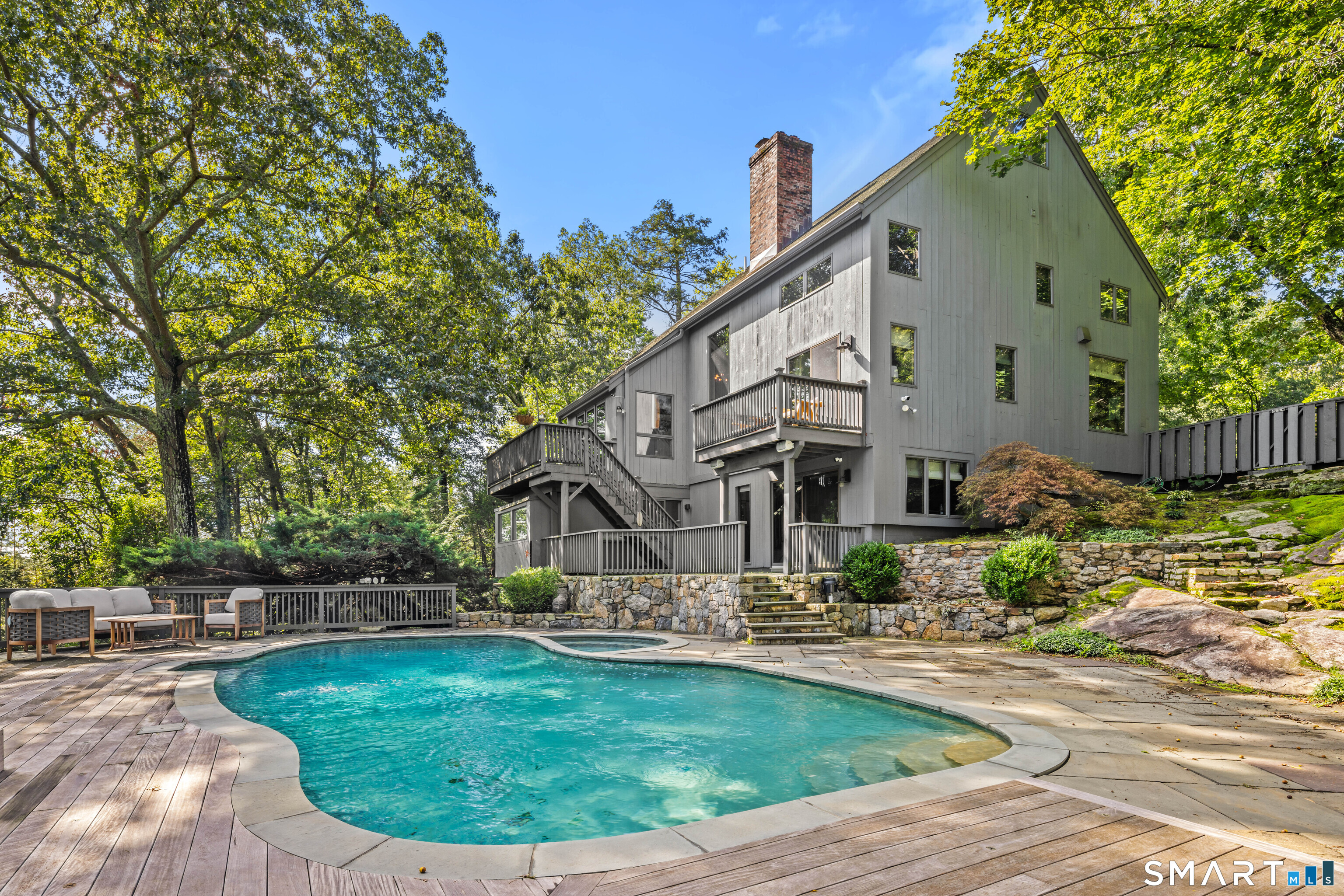 129 Davis Hill Road Weston, CT 06883 - Photo 4 of 40 a front view of a house with garden