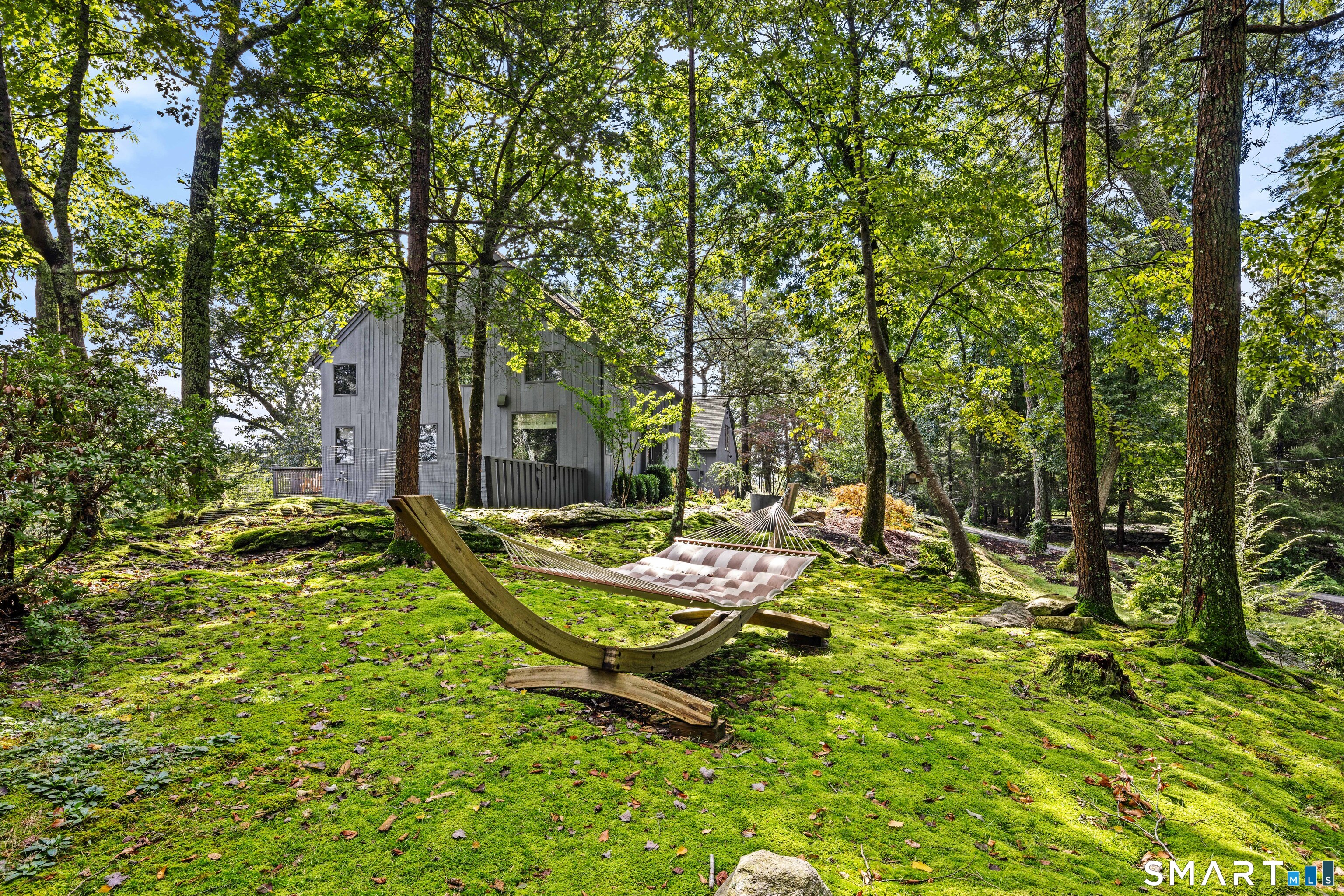 129 Davis Hill Road Weston, CT 06883 - Photo 8 of 40 a view of a backyard with swimming pool