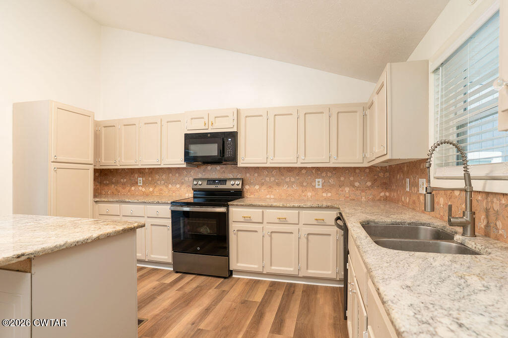 7 Timberlake Drive Jackson, TN 38305 - Photo 12 of 38 a kitchen with a sink stove top oven and microwave