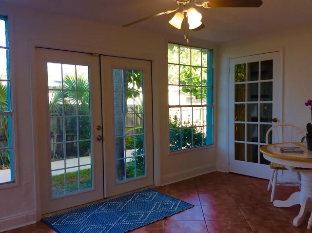a view of workspace with window and wooden floor