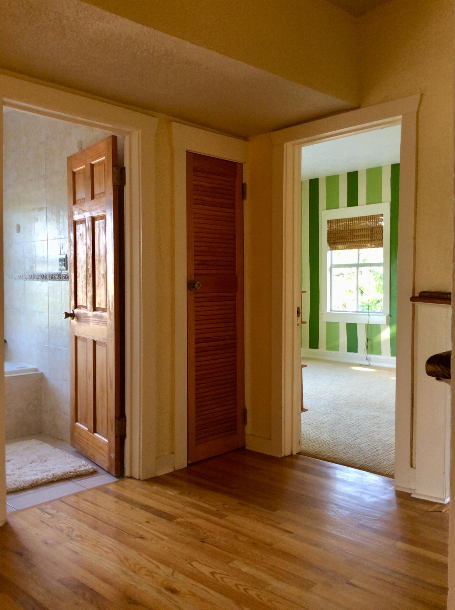 382 Ellamar Road West Palm Beach, FL 33405 - Photo 17 of 39 an empty room with wooden floor and windows
