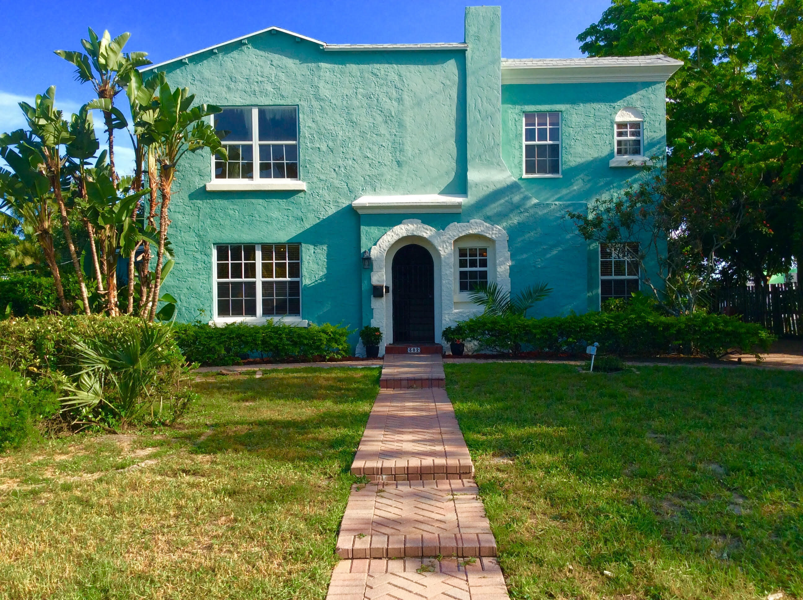 382 Ellamar Road West Palm Beach, FL 33405 - Photo 2 of 39 a front view of a house with garden