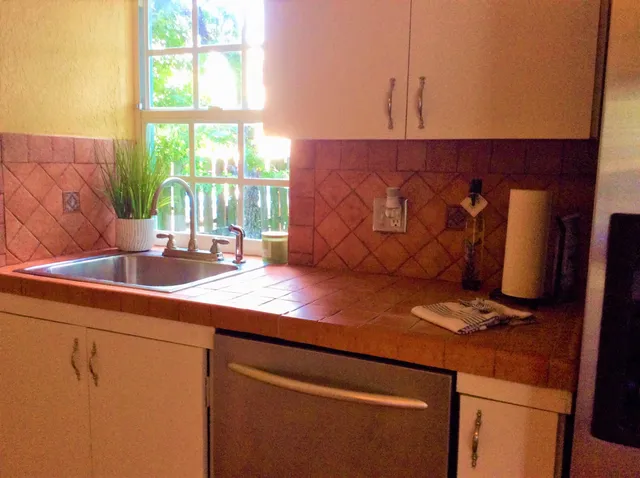 a kitchen with a sink and a window