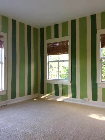 a bathroom with a toilet a sink and a mirror