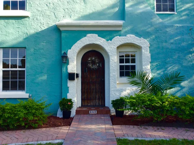 a front view of a house with garden