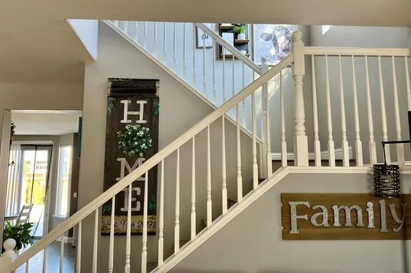 a bathroom with a double vanity sink mirror and bathtub