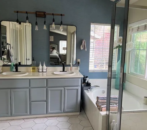 a bathroom with a bathtub and a shower