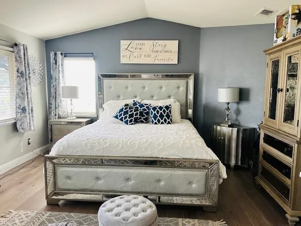 a bedroom with a bed and window