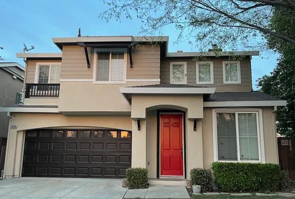a front view of a house with a yard