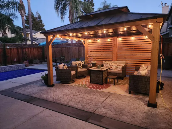 a view of a chairs and tables in the patio