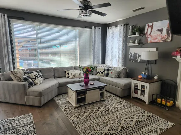 a living room with furniture and a window