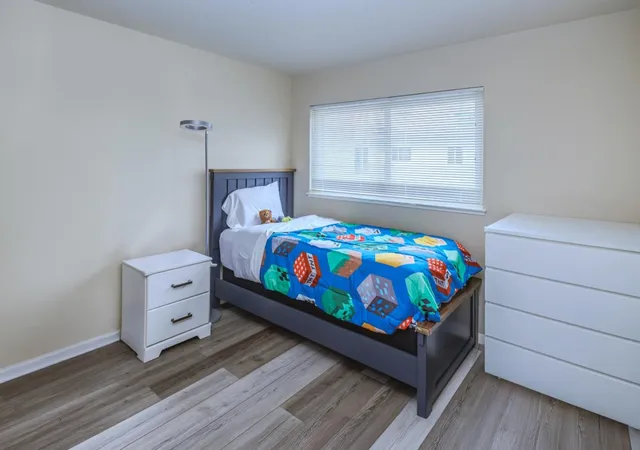 a bathroom with a sink mirror vanity and toilet