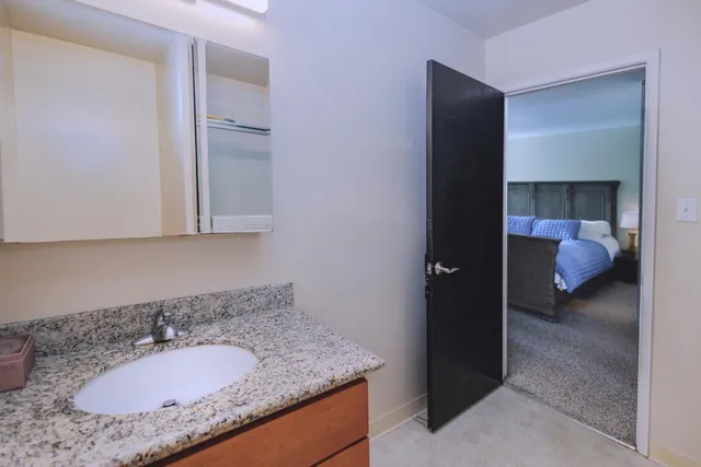 a kitchen with granite countertop cabinets and a sink
