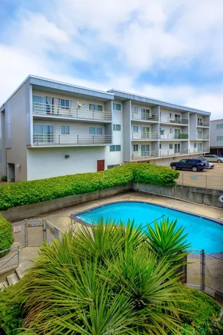 a view of gallery with wooden floor