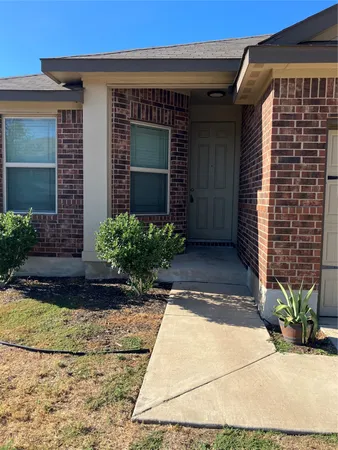 a metallic refrigerator freezer sitting in a kitchen