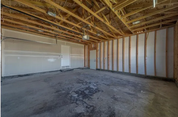 a view of empty room with stairs
