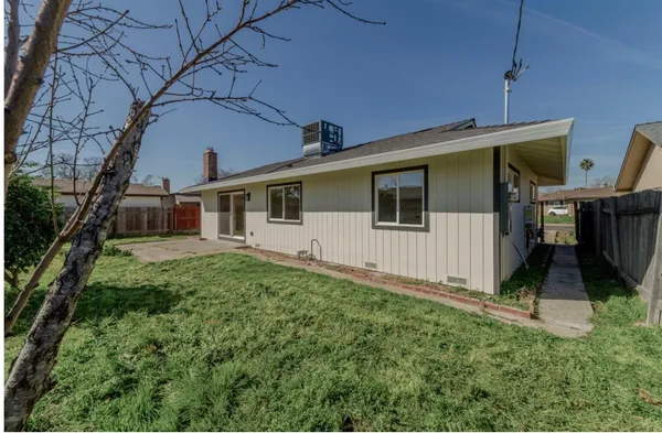 a backyard of a house with lots of green space