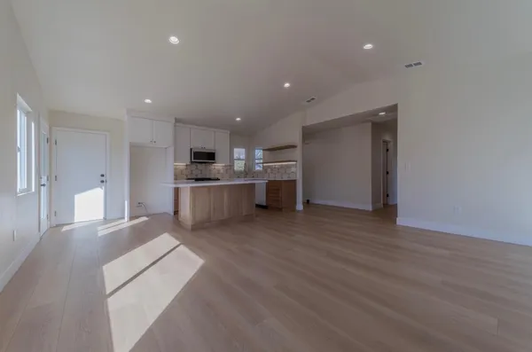 a view of kitchen with wooden floor
