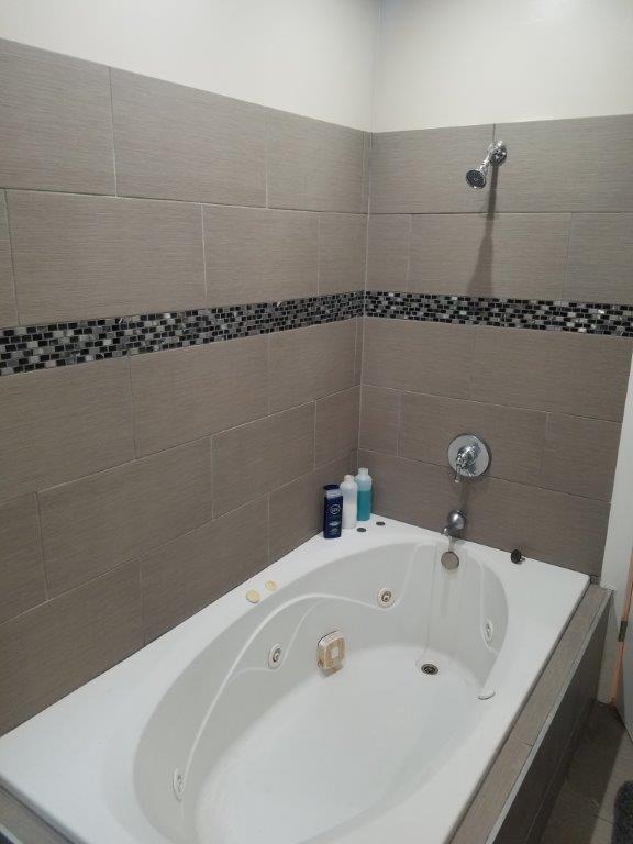 Undisclosed Address Chicago, IL 60610 - Photo 13 of 14 a bathroom with a bathtub and a sink