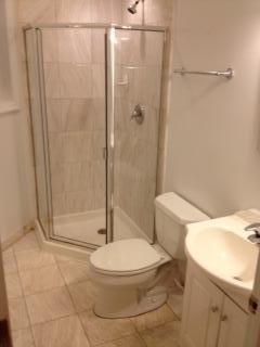 Undisclosed Address Chicago, IL 60610 - Photo 7 of 14 a white toilet sitting next to a bathroom sink