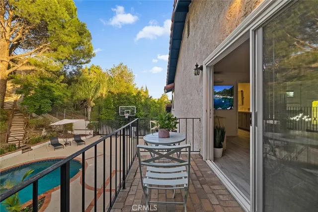 a swimming pool with outdoor seating and yard