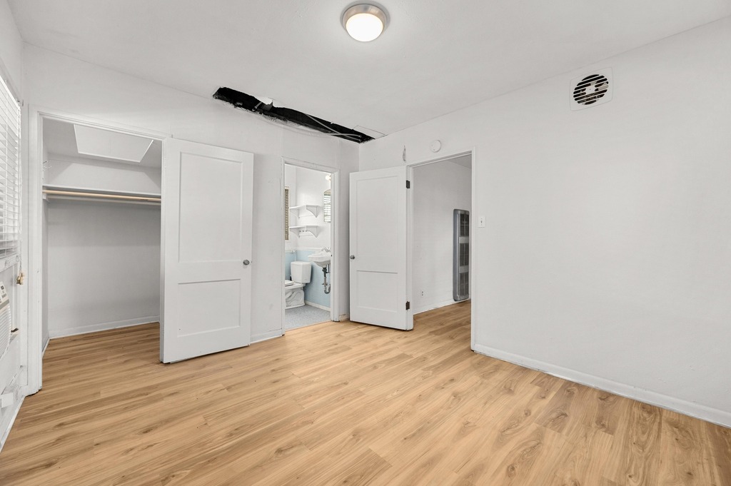 1302 Norwalk Lane Austin, TX 78703 - Photo 11 of 34 a view of empty room with wooden floor