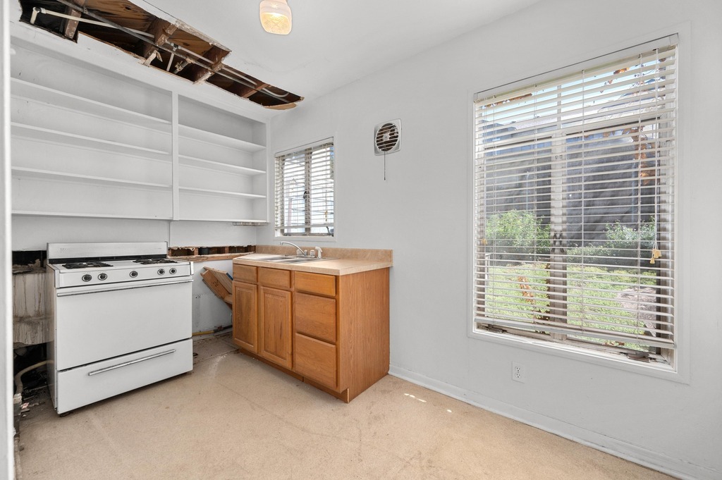 1302 Norwalk Lane Austin, TX 78703 - Photo 13 of 34 a view of a kitchen with stove and cabinets