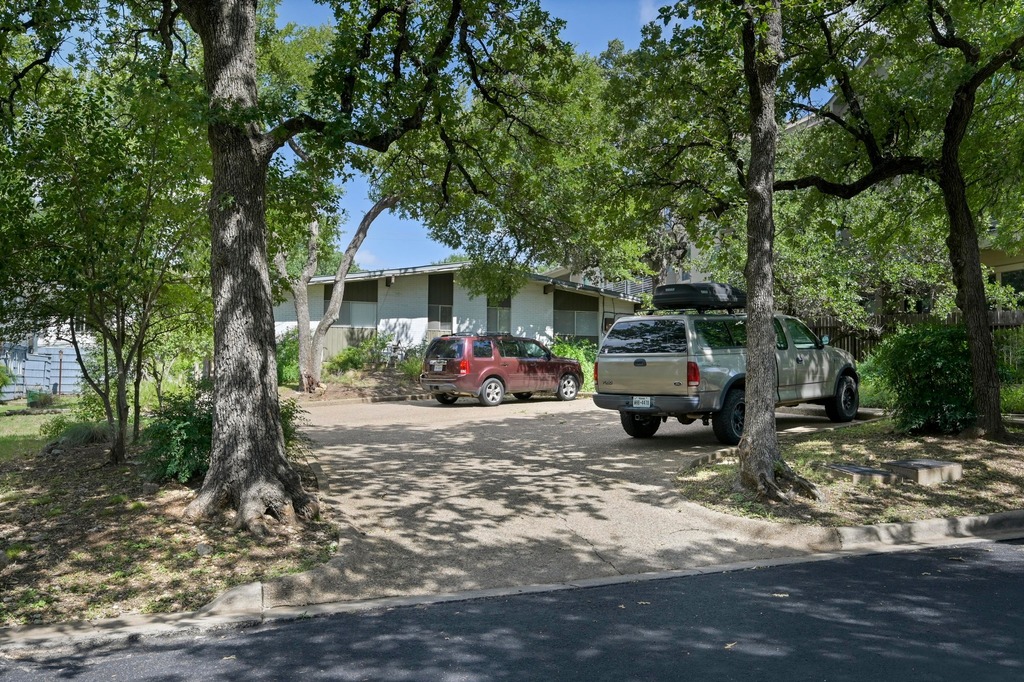 1302 Norwalk Lane Austin, TX 78703 - Photo 19 of 34 a front view of a house with garden