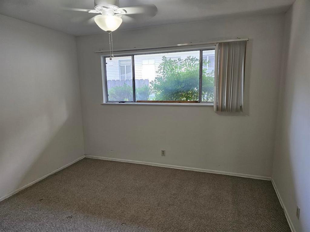 1302 Norwalk Lane Austin, TX 78703 - Photo 23 of 34 an empty room with a window