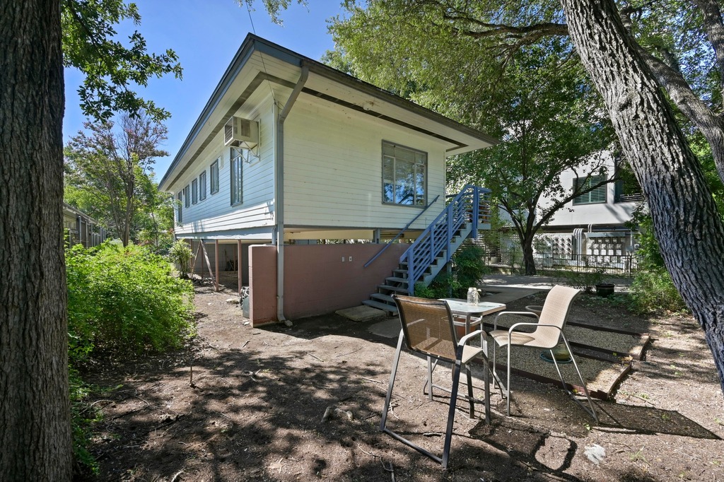 1302 Norwalk Lane Austin, TX 78703 - Photo 6 of 34 a view of a chair and table in backyard