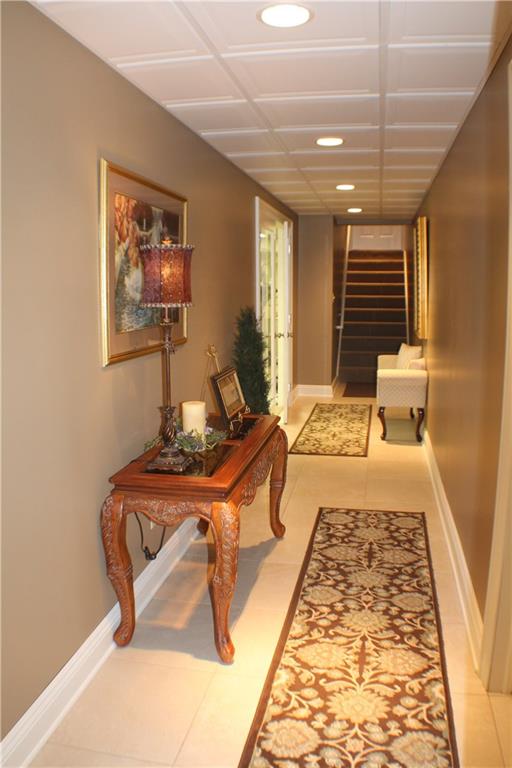 2667 Snake Run Road Wampum, PA 16157 - Photo 22 of 25 Hall/Stairs from Lower Level Leading to Garage