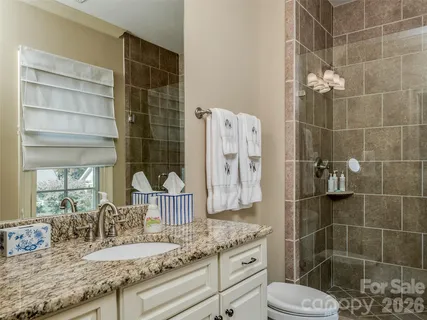 a bedroom with furniture and a flat screen tv