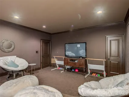 a living room with furniture and a large mirror