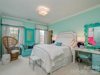 a bathroom with a granite countertop double vanity sink a mirror and vanity